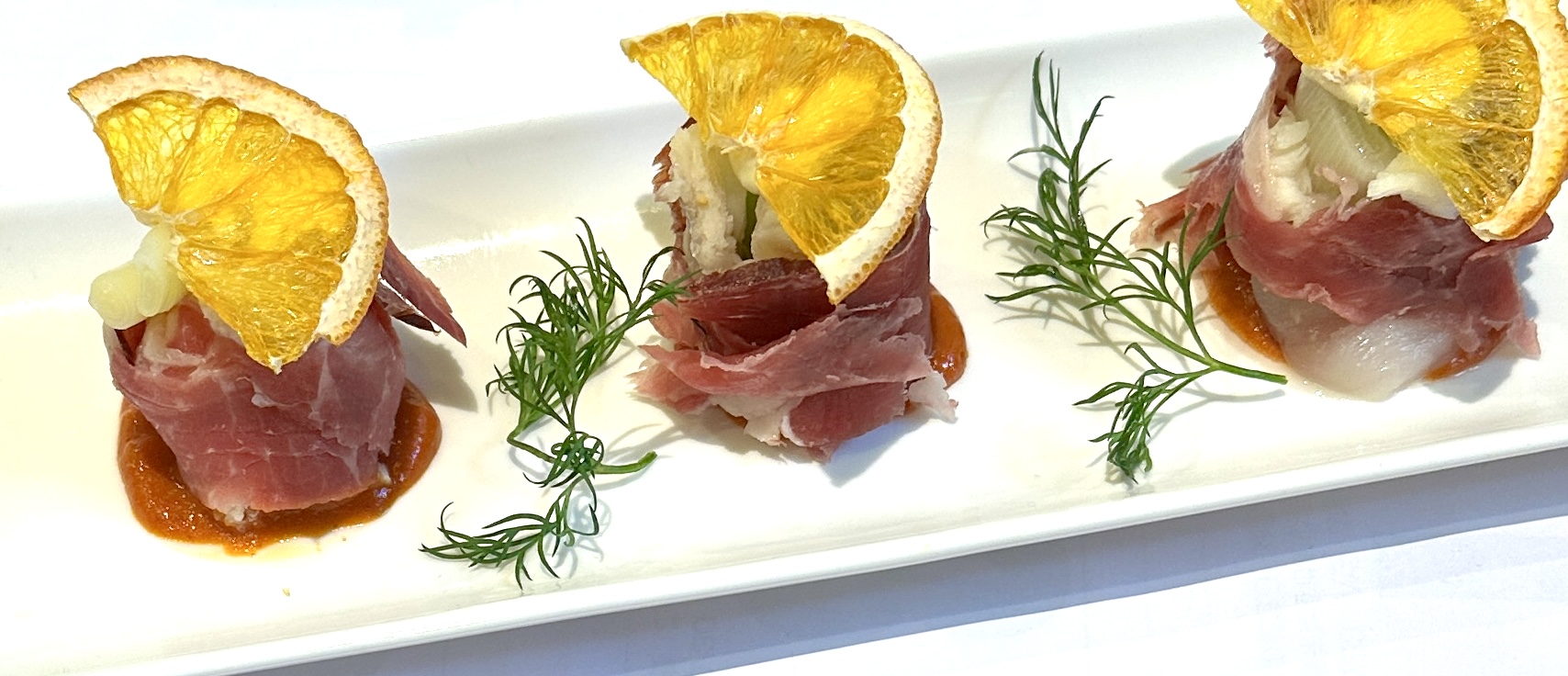 スズキのカルパシオ 生ハム・カルソッツ添え